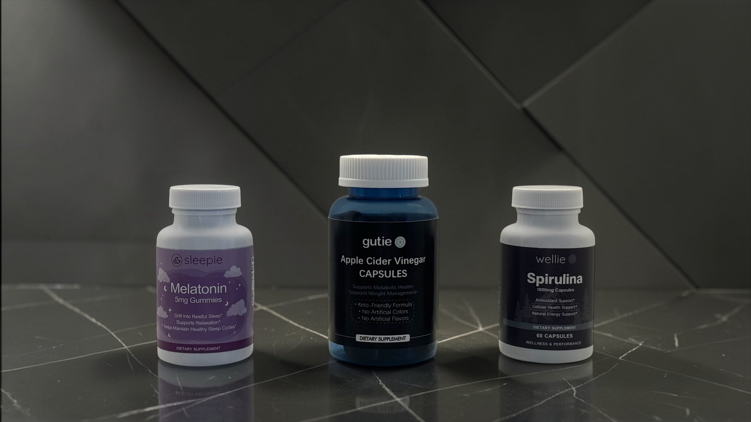 Three supplement bottles on a reflective surface with a dark background
